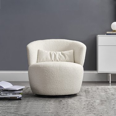 Rounded white boucle chair