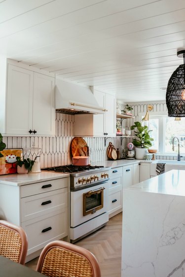 white kitchen cabinets with bohemian decor