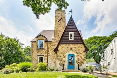 charming tudor cottage with blue front door