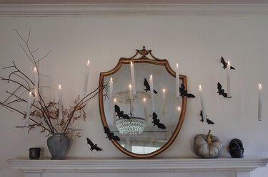 DIY Harry Potter floating candles hanging in front of Halloween mantel