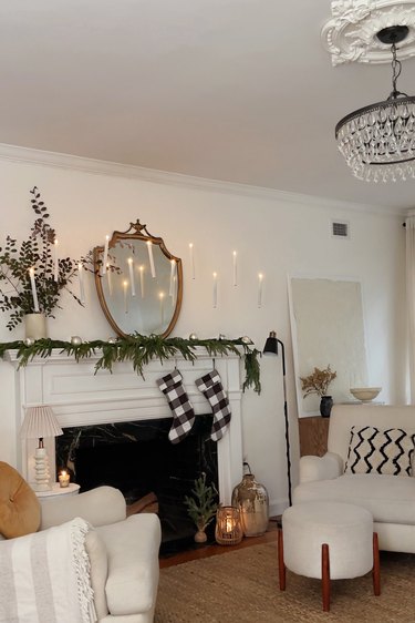 DIY floating candles hanging above holiday mantel