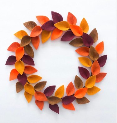 Orange, maroon, brown, and yellow felt wreath