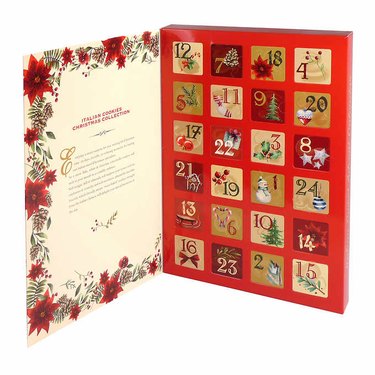 An Antico Mulino Italian Cookie Advent Calendar. A cream colored box with red poinsettias on the side. The Antico Mulino logo is at the top, with images of Italian cookies below.