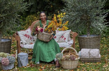 paula sutton at hill house with fall leaves