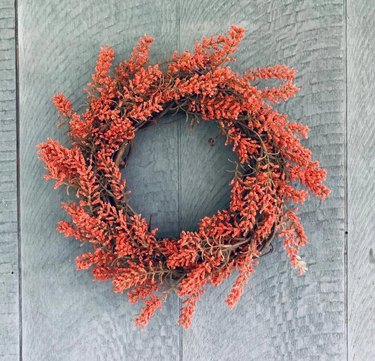 A pinkish red berry wreath