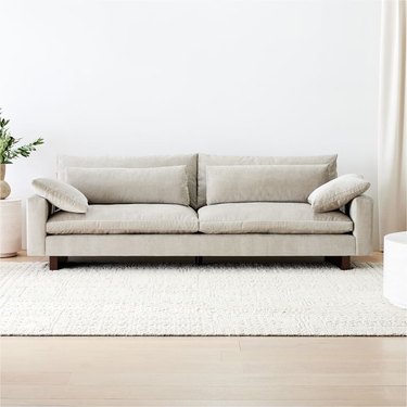comfortable sofa with wood accents