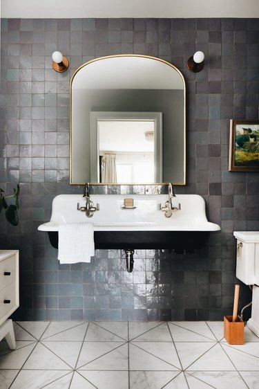 gray bathroom with tile accent wall