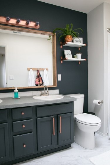 copper and dark gray bathroom