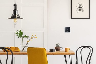 Honeywell Home T5 Smart Thermostat, Black, on Wall of Modern Dining Room