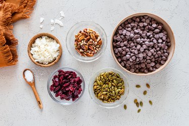 All of the ingredients in glass bowls on a white countertop.