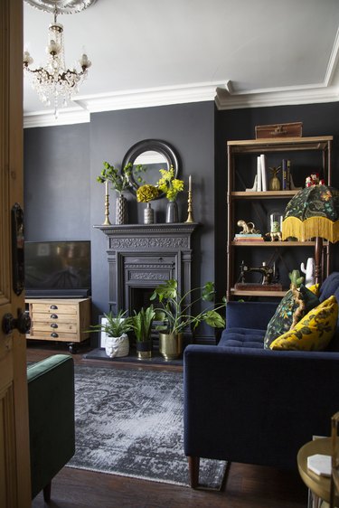 dark living room with dark velvet furniture