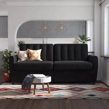 Black ribbed sofa in living room