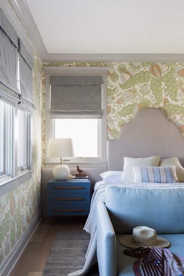 bedroom with green patterned wallpaper