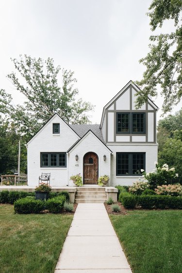 gray and white English Tudor style home exterior