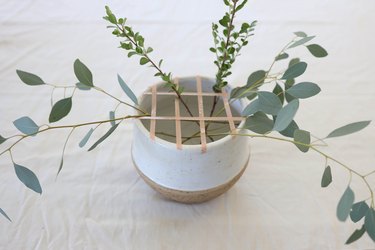 Eucalyptus and greenery added to low floral vase