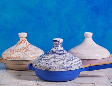 Three tagines in a marbled blue, brown, and lavender color.