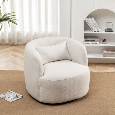 white boucle swivel armchair