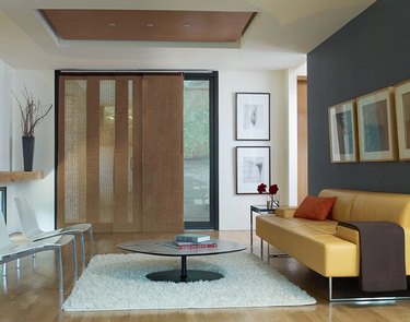 Neutral colored sliding panel blinds in a modern living room
