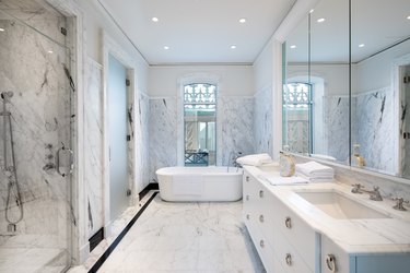 white marble bathroom with soaking tub