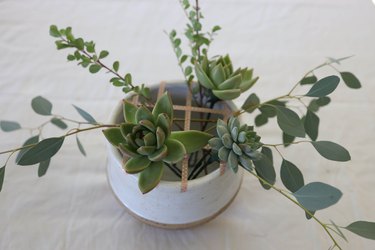 Three succulents added to centerpiece