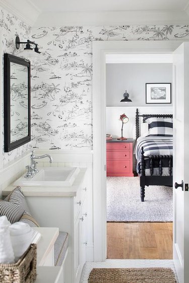 bathroom with black and white toile wallpaper