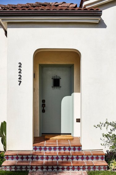 spanish bungalow with beige stucco exterior