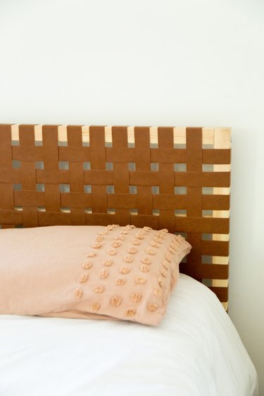 DIY Lattice Headboard Using Leather and an IKEA Bed Frame