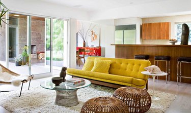 70s style living room with shaggy rug and chartreuse sofa