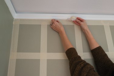 Attaching double-sided tape to the painter's tape grid
