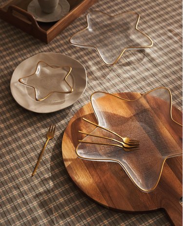 a plaid table with three star-shaped plates