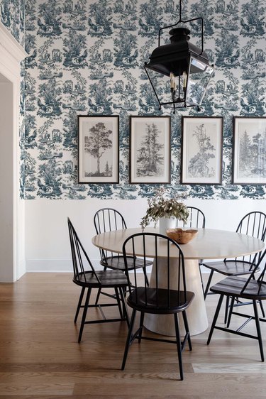 dining room with blue toile print wallpaper