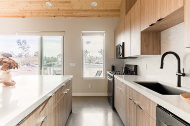 kitchen with light brown cabinets and cream walls