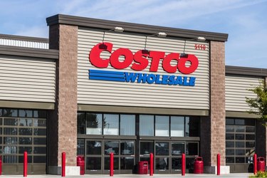 Costco storefront with logo in front of a blue sky.