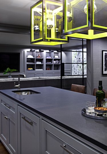gray kitchen cabinets with black countertops
