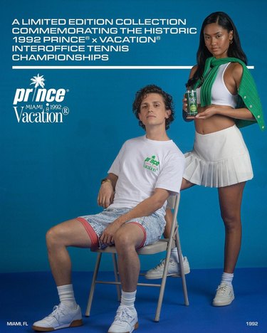 Man in athletic apparel sitting on a chair with woman standing behind him in a tennis outfit