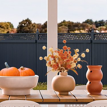 outdoor autumn setup with faux flowers