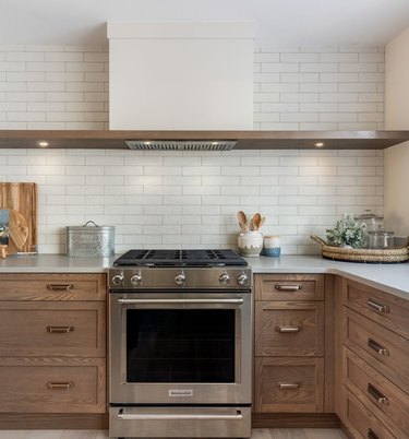 white kitchen with wood lower cabinets