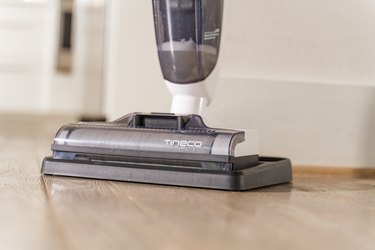 bottom of dry wet vacuum on hardwood floor
