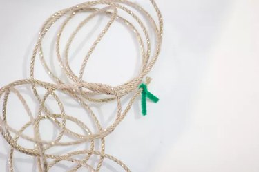 Skinny burlap ribbon tied with green pipe cleaner