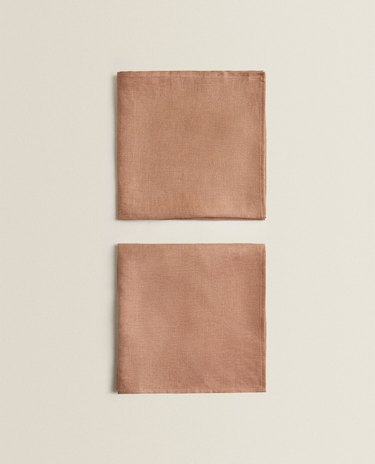 two dark beige linen napkins
