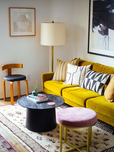 vintage and modern living room with yellow velvet sofa