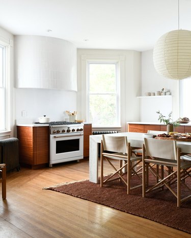 white kitchen with rounded hood and textured walls