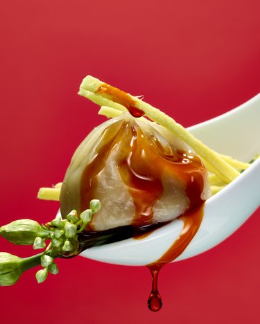 fly by jing dumpling on serving spoon