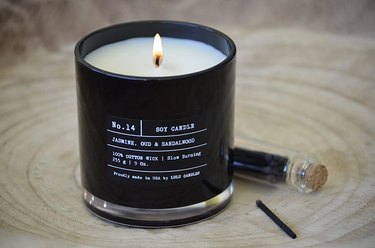 black candle with writing