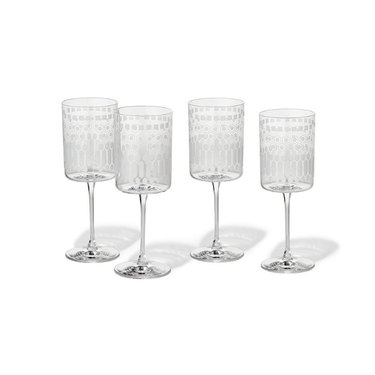A set of four Japanese Gusoku etched white wine glasses.