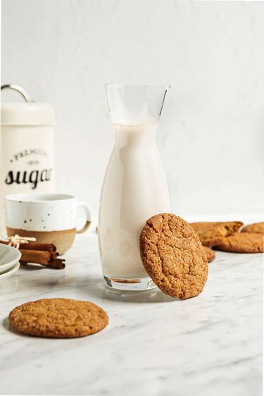 Snickerdoodle cookies and milk on a counter