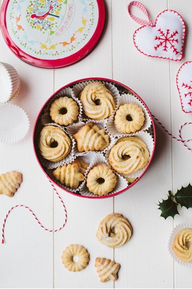 Danish butter cookies in a tin container on a counter