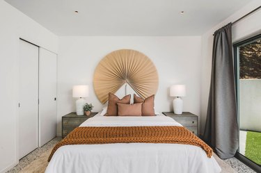 bedroom with white bed and brown accents