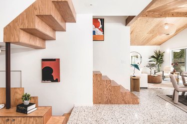 space with plywood staircases and terrazzo floor
