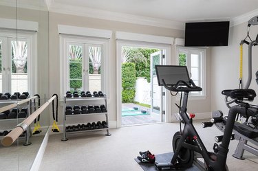 home gym with bike and weights